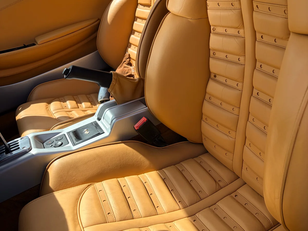 1999 Ferrari 360 Modena beige leather interior after seat bolster repair and steering wheel restoration, New Jersey