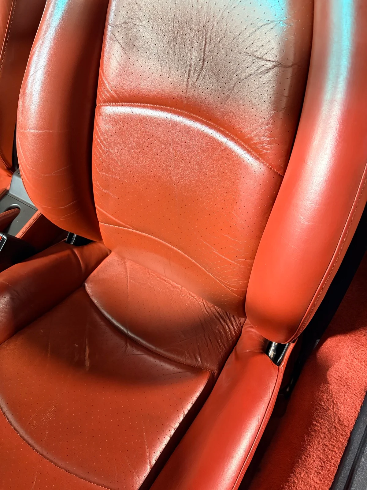 Porsche 993 Carrera S leather seats after bolster restoration — surface wear and scratch repair completed, New Jersey